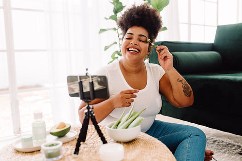 Woman vlogging home skin care treatment