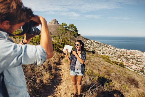 Couple hiking - Excited woman posing for a picture