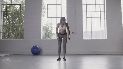 Woman relaxing after workout at fitness studio