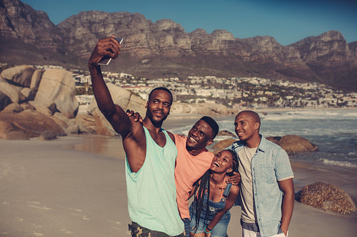 Best friends taking a selfie on the beach