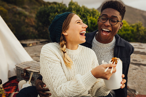 Couple enjoying outdoors on picnic