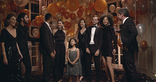 Friends at party posing for a group photo