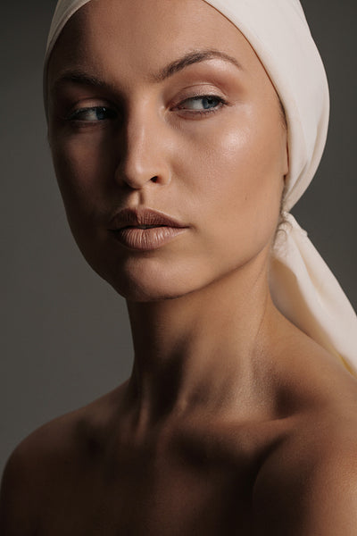Female model with natural makeup and head scarf