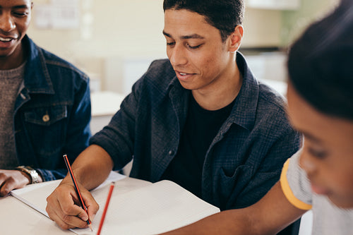 Students doing their studies together at a table