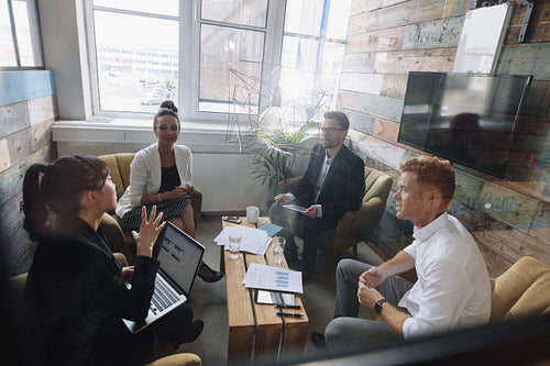 Young business colleagues meeting in modern office