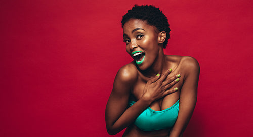 Beautiful young african woman with vivid makeup