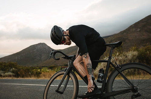 Cyclist adjusting cycling shoe