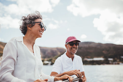 Senior couple enjoying a leisurely sail out on the sea