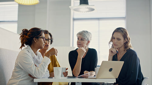 Colleagues discussing project details