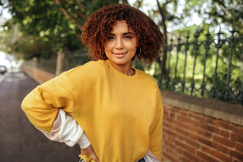 Cheerful teenage girl looking at the camera with a smile on her