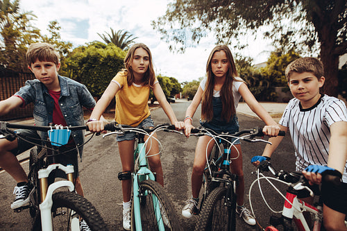 Kids playing outdoors on bicycles