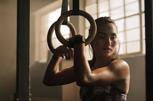 Woman taking break from workout at gym