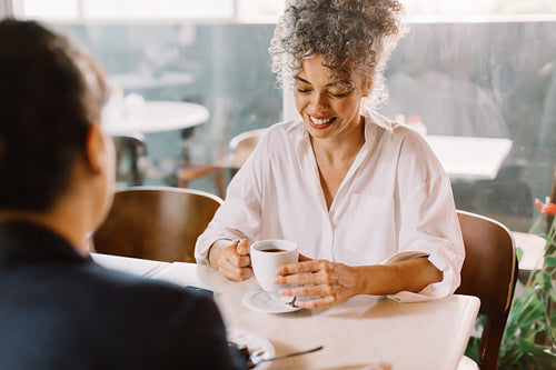 Businesswoman meeting with a client in a cafe