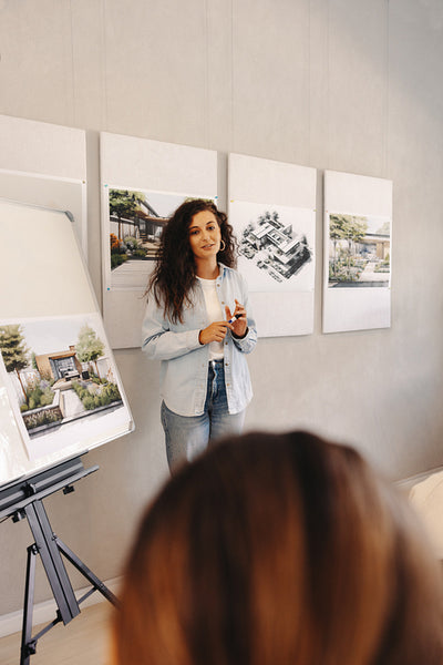 Female architect presenting design concepts during a professional meeting