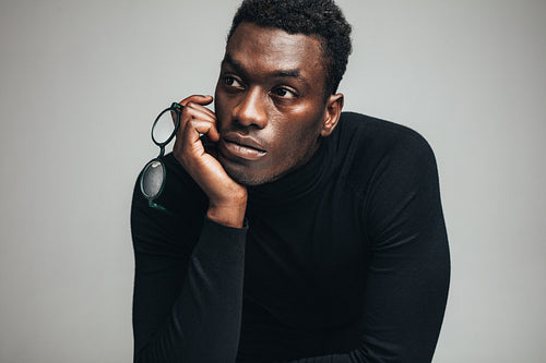 Thoughtful young african guy