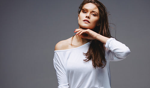 Beautiful woman posing on grey background