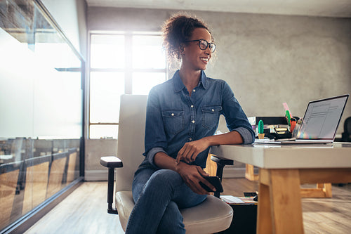 Young woman entrepreneur at her desk