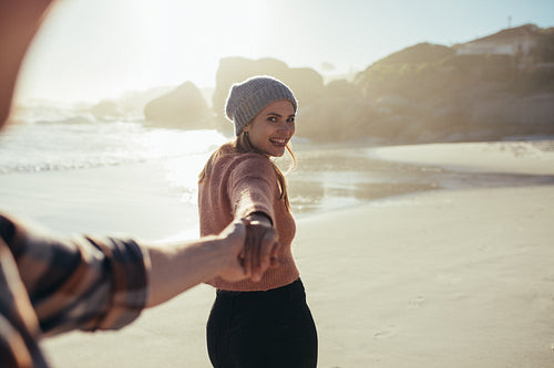 Young couple walking along the beach