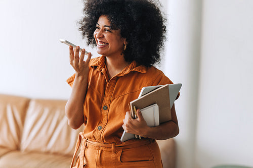 Female business professional taking a phone call in an office