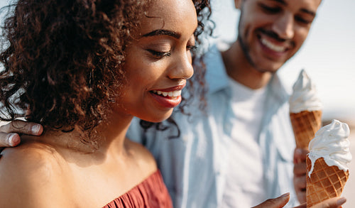Close up of a couple eating ice creams