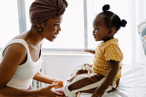 Mother and daughter share joyful moment at home