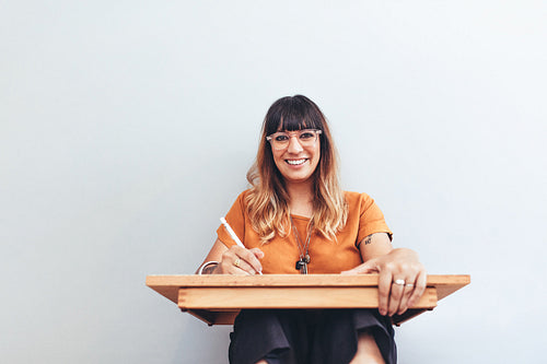 Close up of a smiling creative artist at work