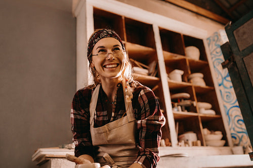 Female potter in pottery workshop