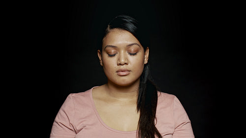 Woman with eyes closed