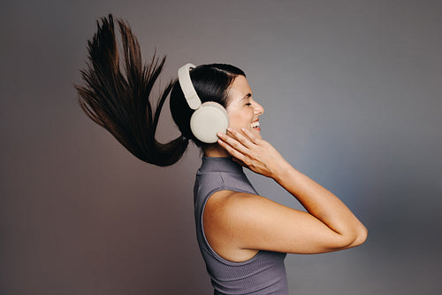 Listening to happy music on wireless headphones