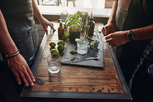 Barmen preparing new cocktail recipe