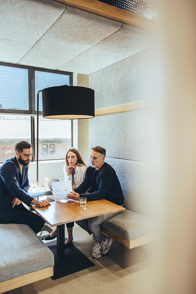 Businesspeople looking at a report