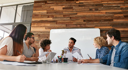 Creative team discussing new strategy of their company