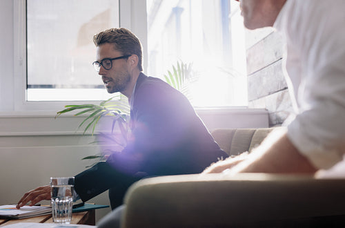 Businessman explaining business plan to colleagues