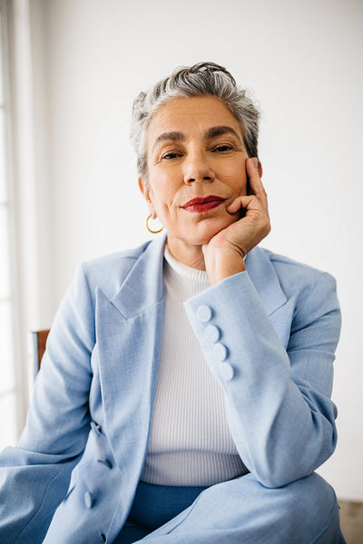 Success and style: Senior business woman dressed in a suit at work