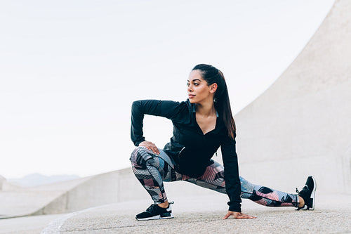 Fit woman doing stretching workout