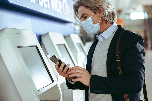 Businessman using self check in at the airport