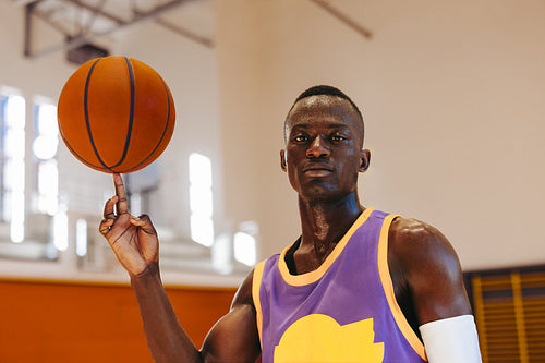 On point: Young basketball player spins ball on fingertip