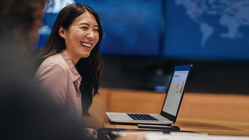 Businesswoman smiling in office meeting