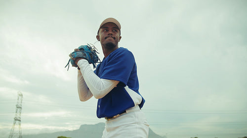 Focused baseball pitcher throws a powerful fastball