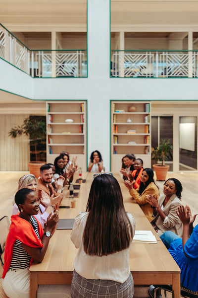 Successful team session with applause in a modern business meeting room