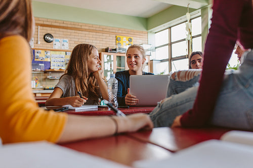 Students talking in classroom after the lecture