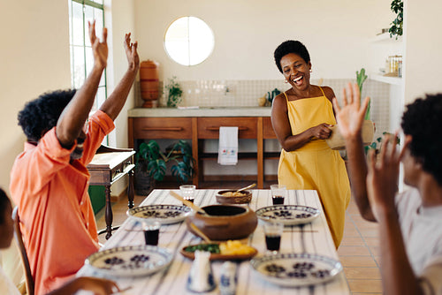 Family celebrating Brazilian cuisine with excitement