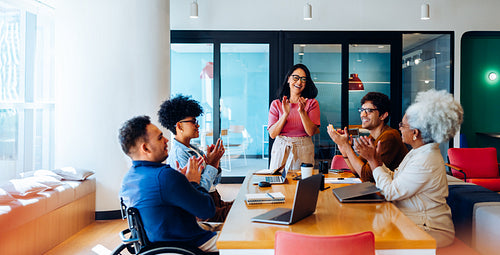 Recognizing success: The team applauds a job well done