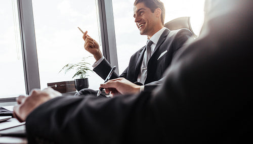 Smiling businessman during a meeting in office