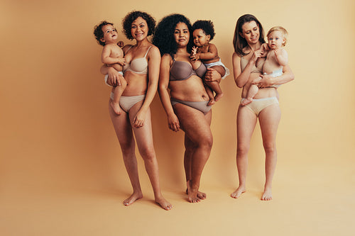 Woman celebrating their mom bods