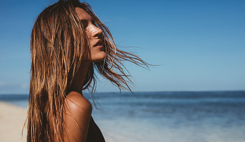 Beautiful young woman on the beach