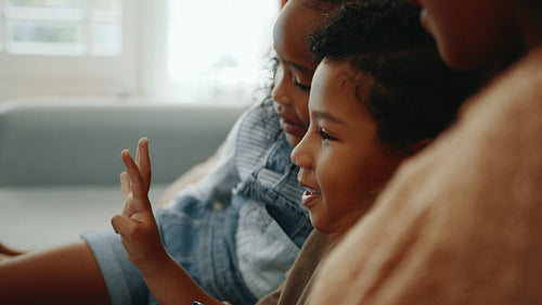 Staying connected during military deployment: Little boy talking to his deployed father on a video call