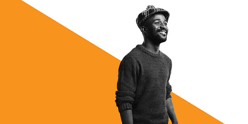 Portrait of smiling male in tartan cap