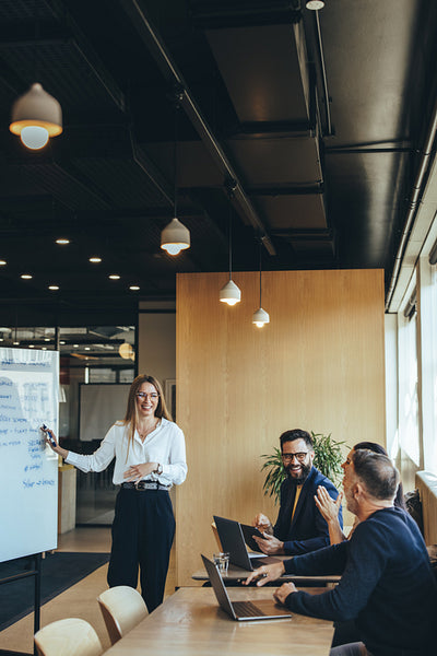 Cheerful businesspeople smiling during a presentation
