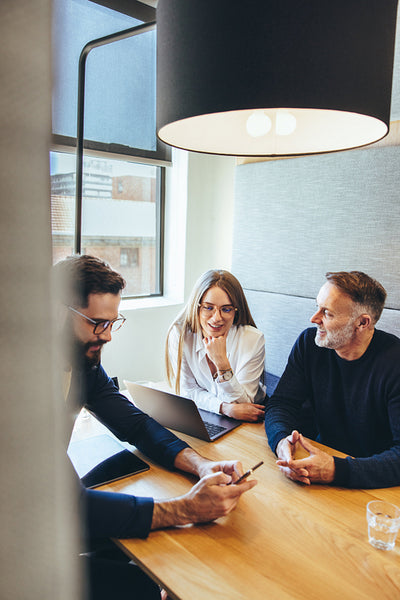Happy businesspeople working in a co-working space